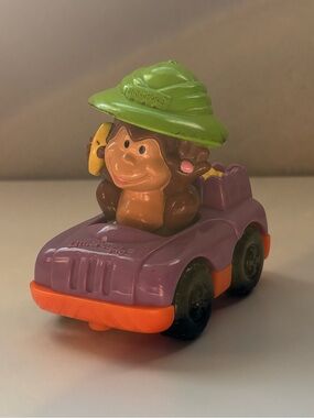 Fisher price little people monkey with a banana wheelie McDonald’s car